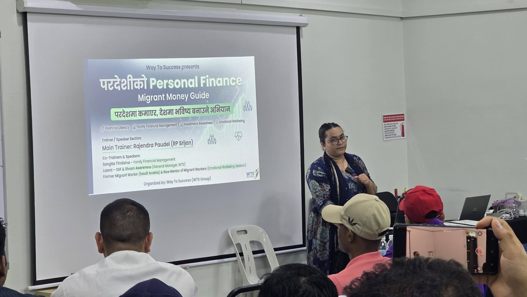 Rajendra Paudel speaking at migrant worker financial literacy training